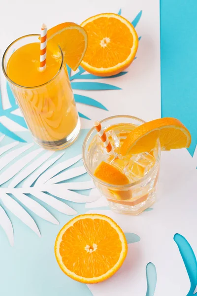 Orange juice in glass and fresh fruits — Stock Photo, Image