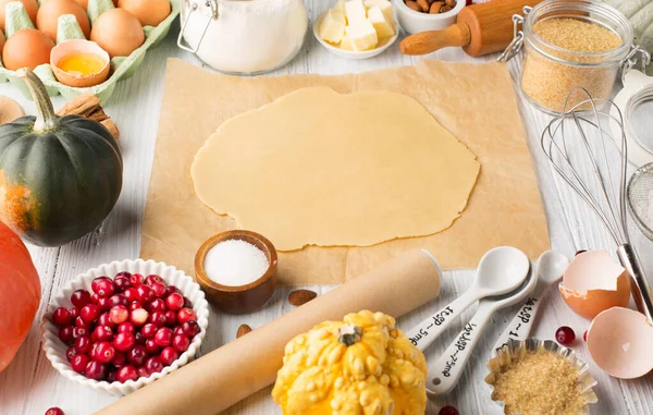 Autumn winter baking concept. Cooking baking background with ingredients, spices and utensils. Baking traditional autumn winter pie, rustic white wooden background, copy space.