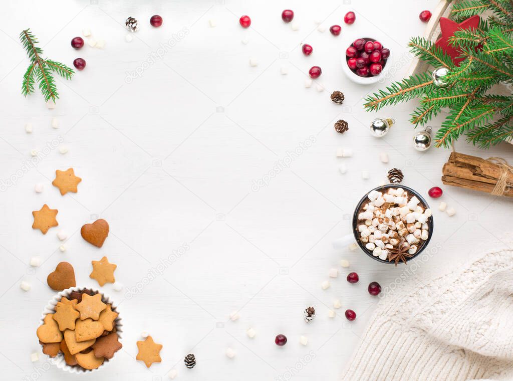 Rustic white wooden background with cup of hot chocolate drink and Christmas cookies. Seasonal background from above. Flat lay, top view. Holiday card mockup, copy space