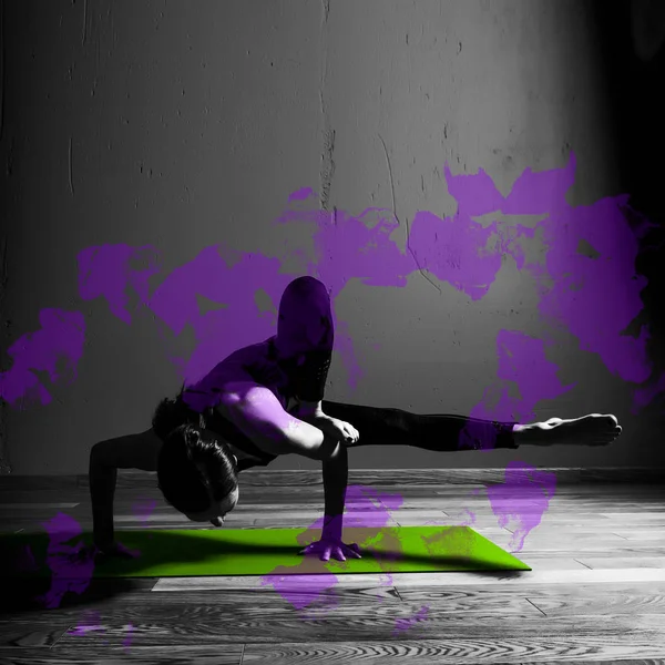 Black white photo of Young beautiful woman brunette in black clothes practice yoga Parivritta Kaundiniasana in dark studio green mat Purple design element — Stock Photo, Image