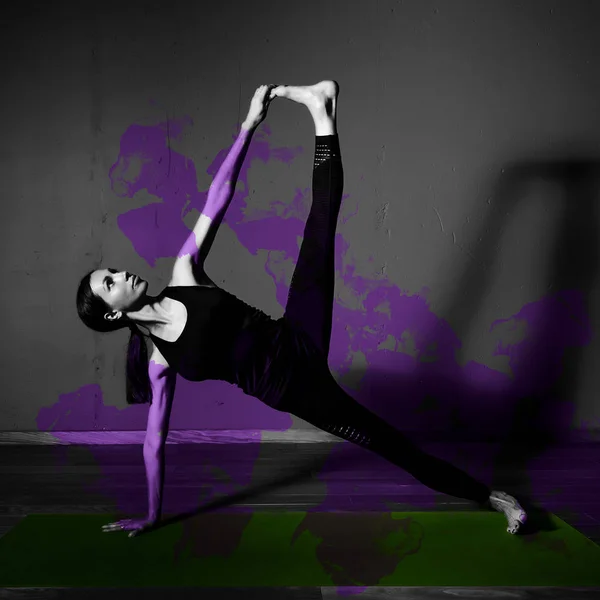 Black white photo of Young beautiful woman brunette in black clothes practice yoga kumbhakasana in dark studio green mat Purple design element — Stock Photo, Image