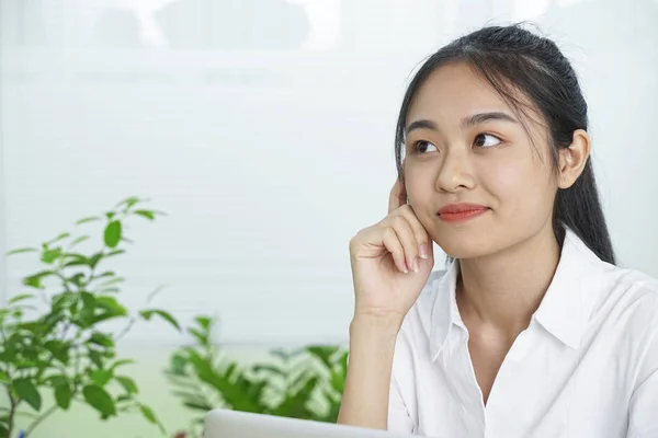 Asian cheerful pretty young teenage student in white uniform and black skirt — Stock Photo, Image