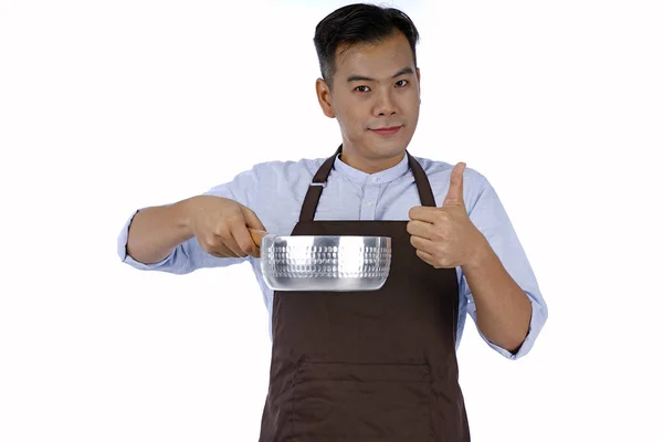Asiatique beau jeune homme tenant pot de cuisson avec une bonne saveur, isol — Photo