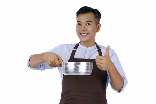 Asiatique beau jeune homme tenant pot de cuisson avec une bonne saveur, isol — Photo