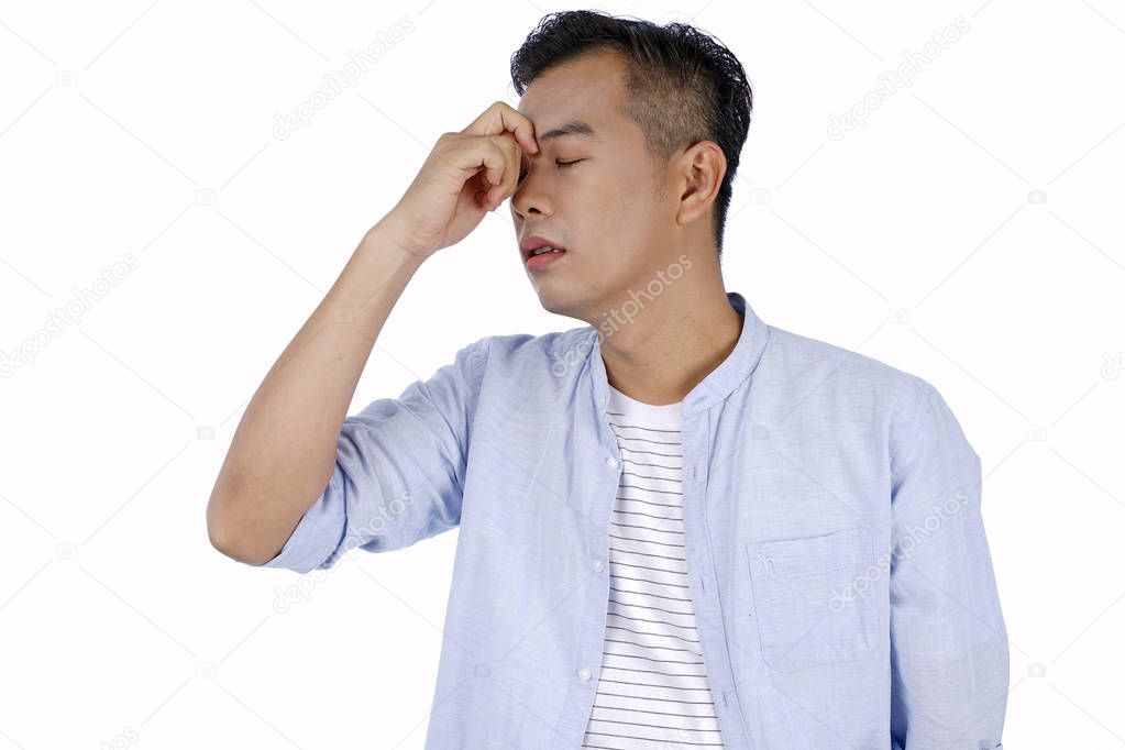 Asian handsome young man with pain, in bright colors clothes, is