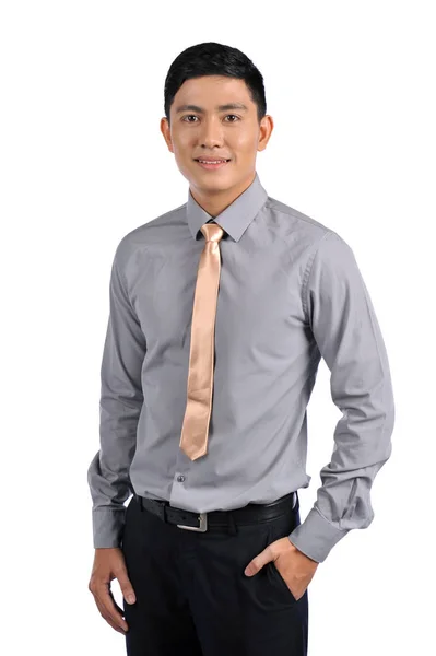 Aziatische jonge knappe aantrekkelijke man in uniform geïsoleerd op witte achtergrond — Stockfoto