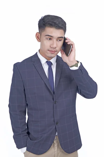 Asian young attractive handsome business man with smart phone, wear suit, isolated on white background — Stock Photo, Image