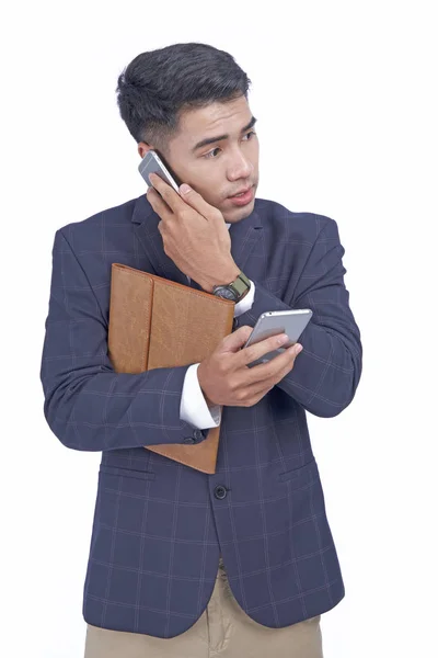 Asian young attractive handsome busy business man with smart phone, wear suit, isolated on white background — Stock Photo, Image