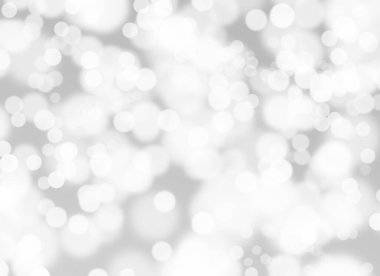 Soyut beyaz Bokeh. Gri arkaplanda bulanık daire ışığı.