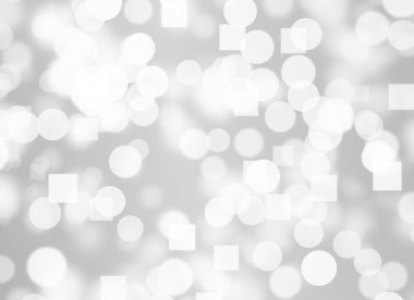 Soyut beyaz Bokeh. Gri arkaplanda bulanık daire ışığı.