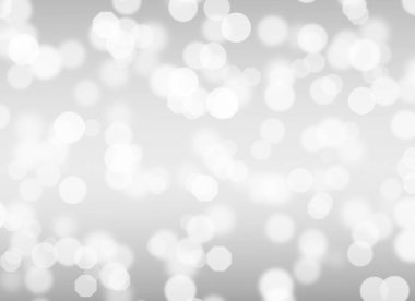 Soyut beyaz Bokeh. Gri arkaplanda bulanık daire ışığı.
