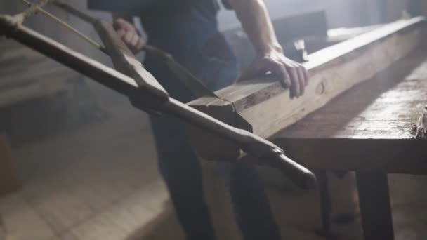 Young Man Working Wear Sawing Wood Hacksaw — Stock Video