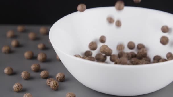 Chocolate Cereals Slowly Starting Falling Bowl — Stock Video