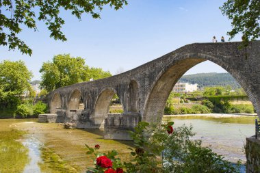 The famous stone bridge of Arta, in Epirus region, in Greece. It is the most legendary stone bridge in Greece. clipart