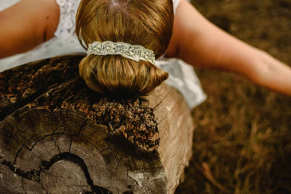 Bridal hairstyle resting on a trunk