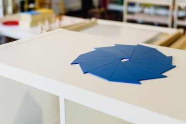 Geometry and mathematics materials in a Montessori classroom clipart