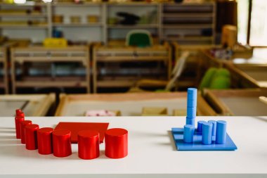 Geometry and mathematics materials in a Montessori classroom clipart