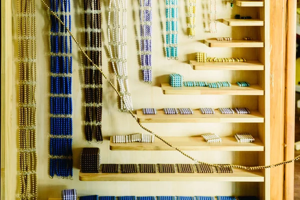 educational materials to learn to count in a beads cabinet Montessori classroom.