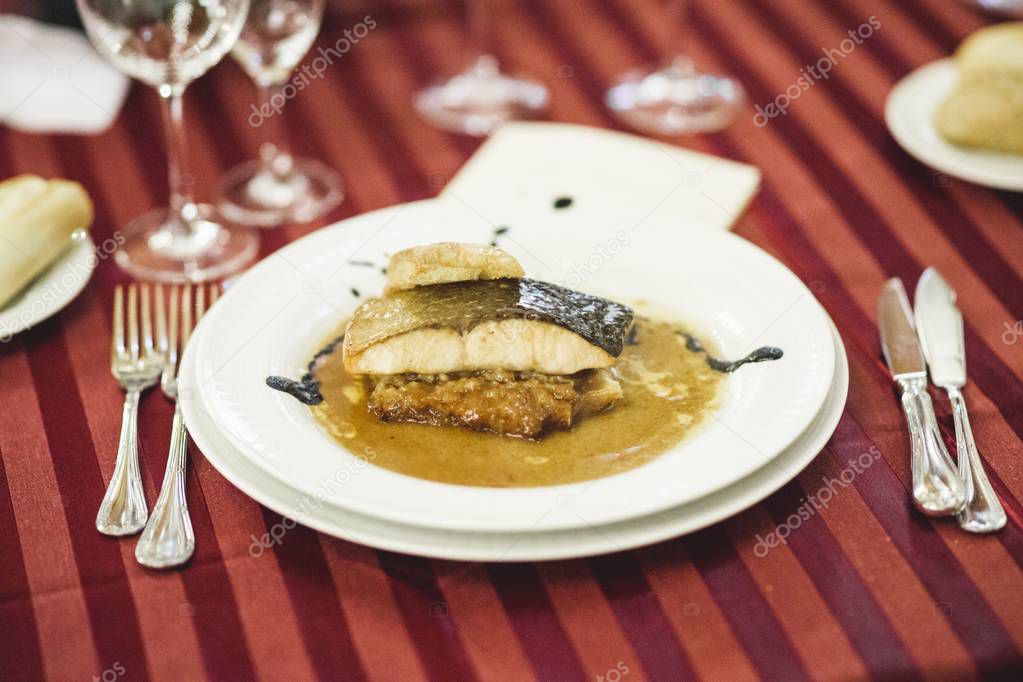 Hake dish with sauce served during a wedding