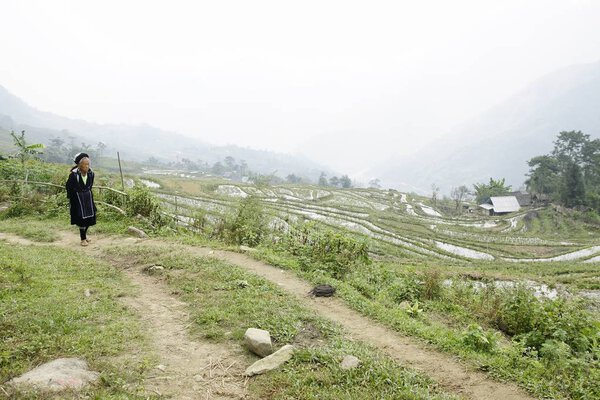 Sapa, Vietnam - August 8, 2017: Villagers dressed in their traditional costumes of the Hmong tribe from the mountains of North Vietnam, border with China.