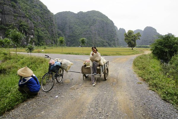 Sapa, Vietnam - July 18, 2013; Vietnamese farmers and fishermen in rural villages.