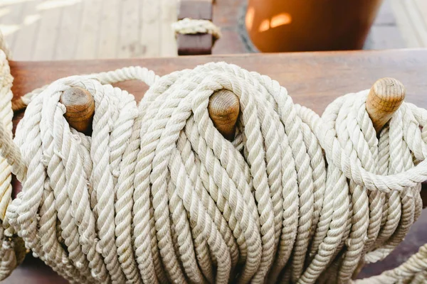 Knotted boat ropes to hold sails.