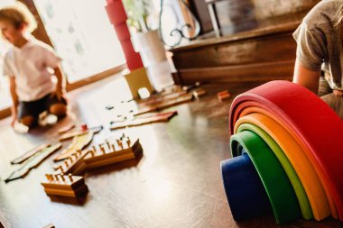 Children playing with wooden rainbow waldorf montessori clipart