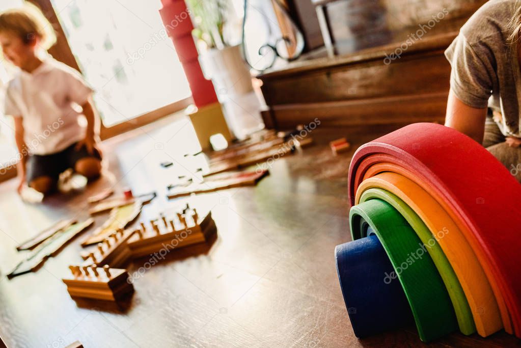 Children playing with wooden rainbow waldorf montessori