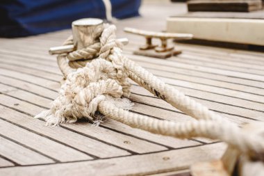 Ropes, cleats and bollard to tie the boats to port. clipart