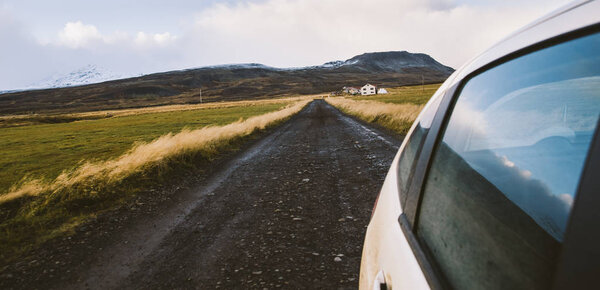 View from a car at full speed of a gravel road during an adventure trip.