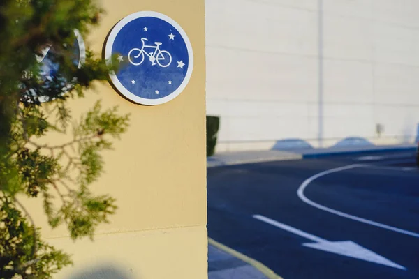 Blue circular sign indicating bicycle lane and allowed circulation on bicycles, concept of healthy mobility and respect for the environment.