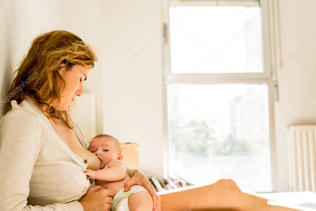 Baby breastfed for breast milk, alternative maternity concept