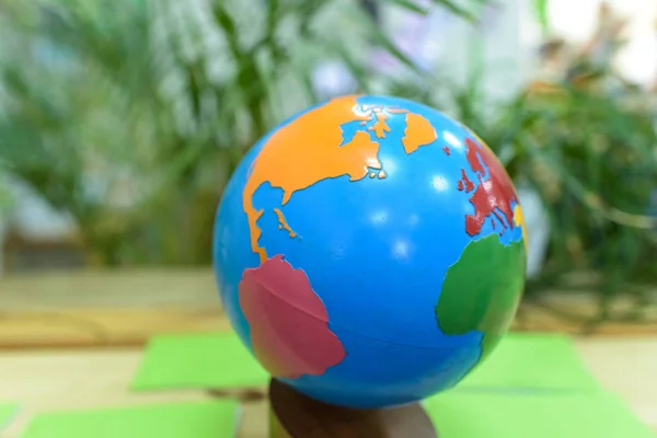 Earth globe in a montessori school with the americas and europe.