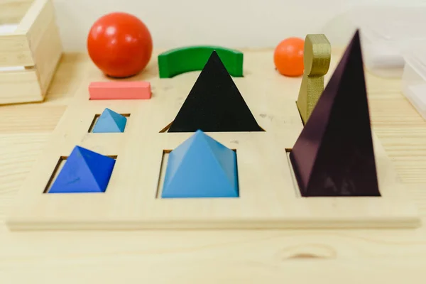 Montessori materials to learn geometry in a school.