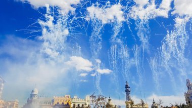 Fireworks fired in a Mascleta Fallas during the day. clipart