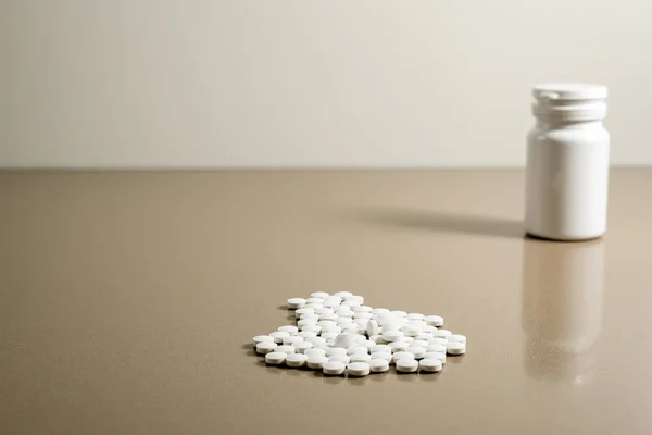 White pills to cure diseases isolated on gray background, copy p — Stock Photo, Image