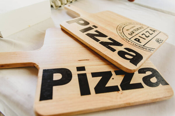 Valencia, Spain - March 2, 2019: Wooden boards to cut and place 