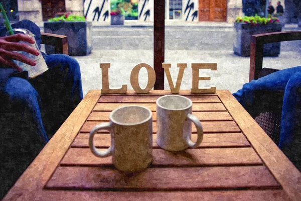 Słowo miłość obok dwóch filiżanek kawy na stole w stołówce, — Zdjęcie stockowe