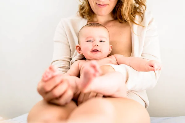 Baby on his happy mother. — Stock Photo, Image