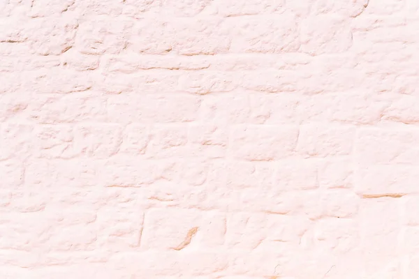 Mur de pierre peint entièrement blanc, au soleil, idéal pour utiliser comme — Photo