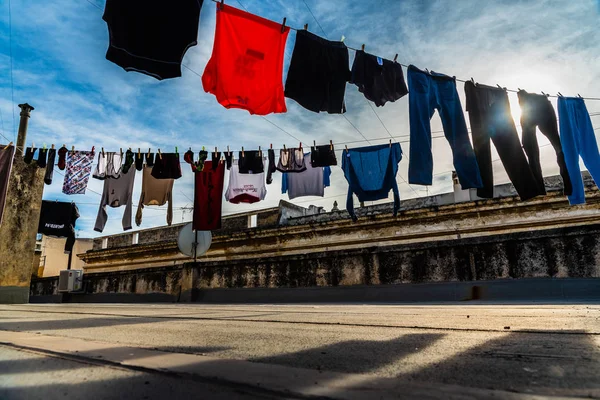 Bari, Italy - March 10, 2019: Clothes hanging from a rope drying — Stock Photo, Image