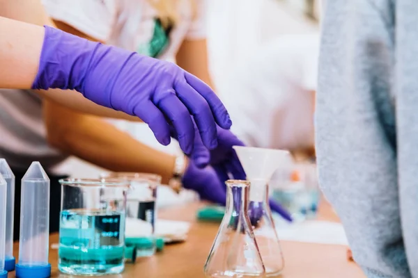 Researchers using liquids in test tubes. — Stock Photo, Image