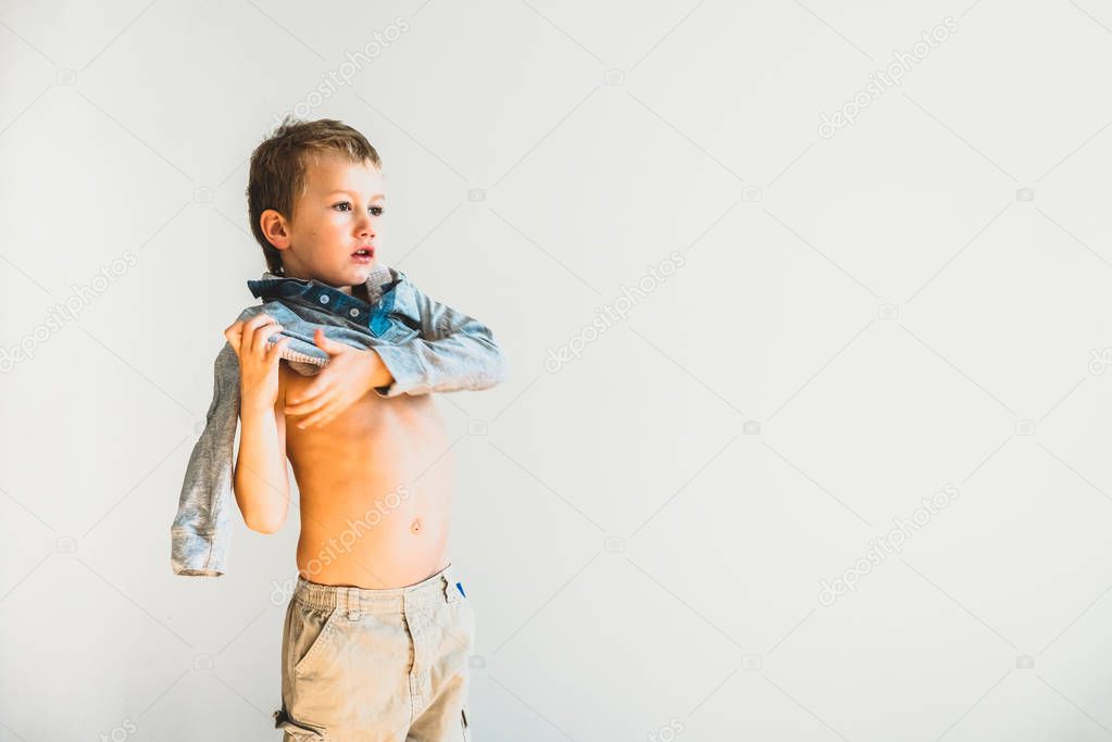 Child undressing before going to sleep, alone, learning to be in