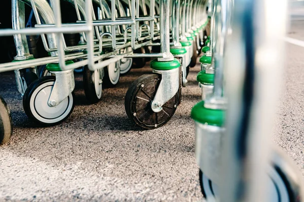 Detail of the plastic wheels of shopping carts in a supermarket