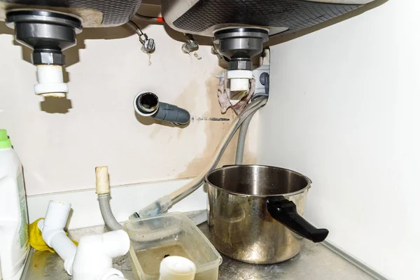 Drain of a sink pipe clogged with dirt, disassembled by a plumbe — Stock Photo, Image