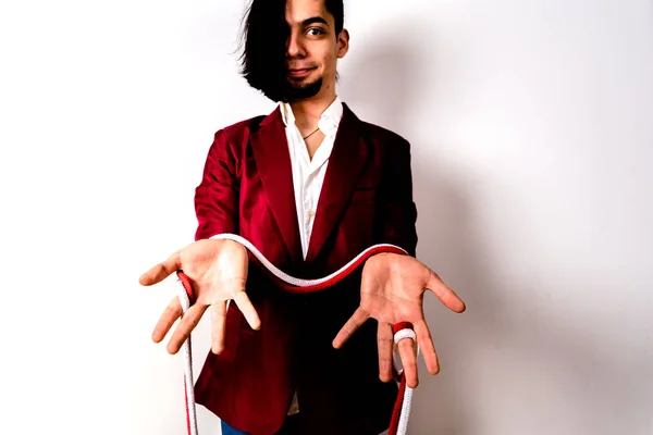 Magician hands handling ropes and bandanas to do magic tricks, isolated on white. — Stock Photo, Image