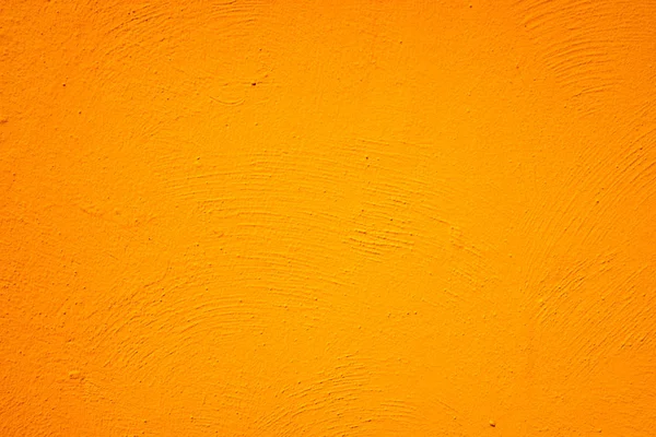 Orange painted wall with background and texture.