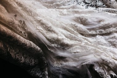 Detail of the texture of a white wedding dress. clipart