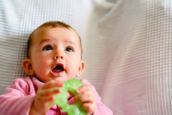 Adorable funny baby girl smiling with pink pajamas. — Stock Photo, Image