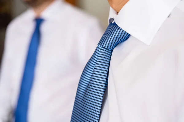 Detail of men's ties in white shirt, unfocused white background, — Stock Photo, Image